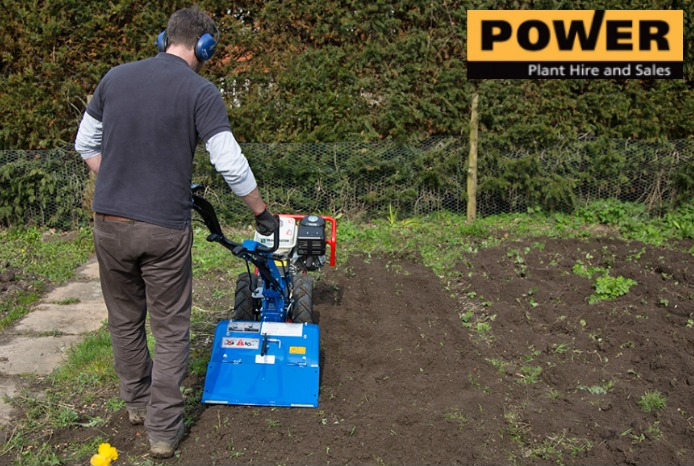 Man working with gardening equipment
