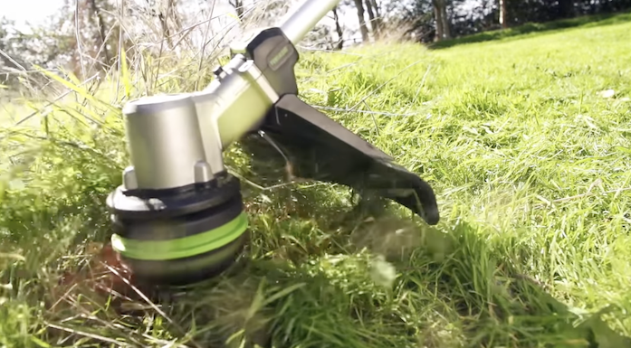 Line trimmer trimming grass