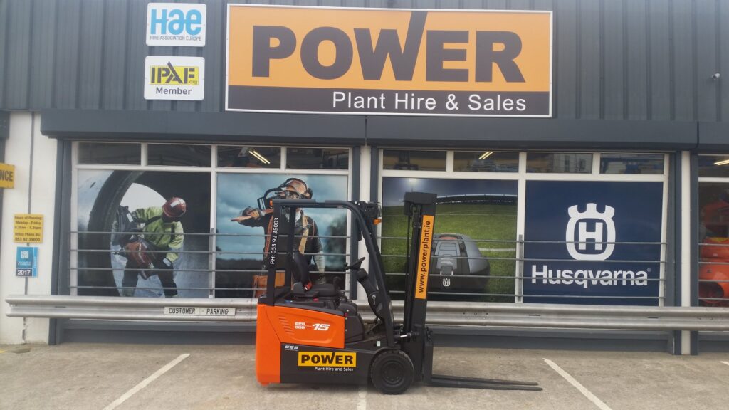Orange forklift with Power Plant hire logo